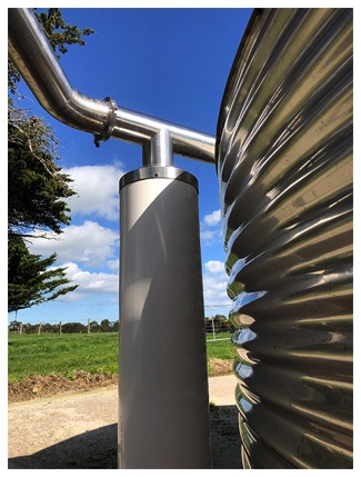A first-flush diverter discards the first wash of rain from the roof, improving the end quality of collected water